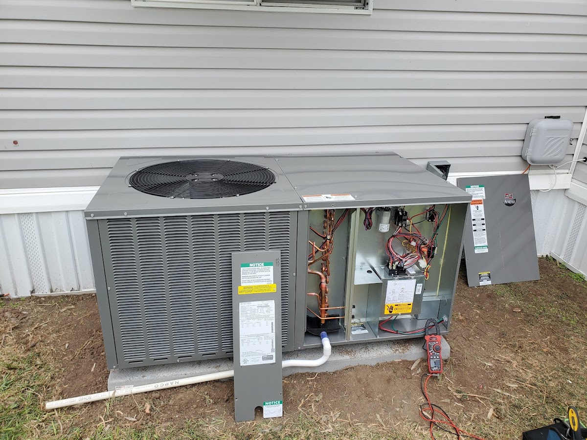 New A/C package unit installation with access panel open