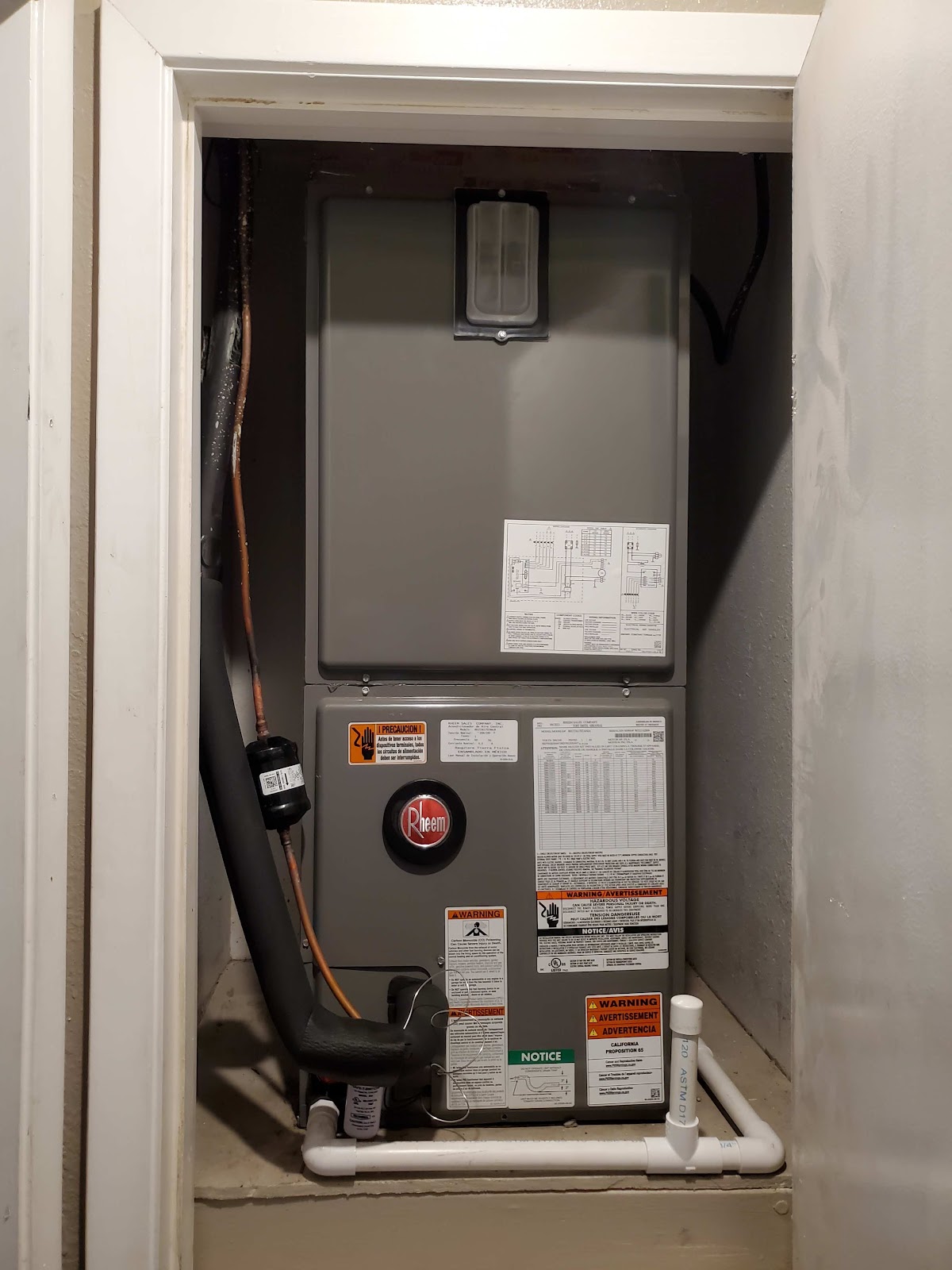 New Rheem air handler installed in a utility closet