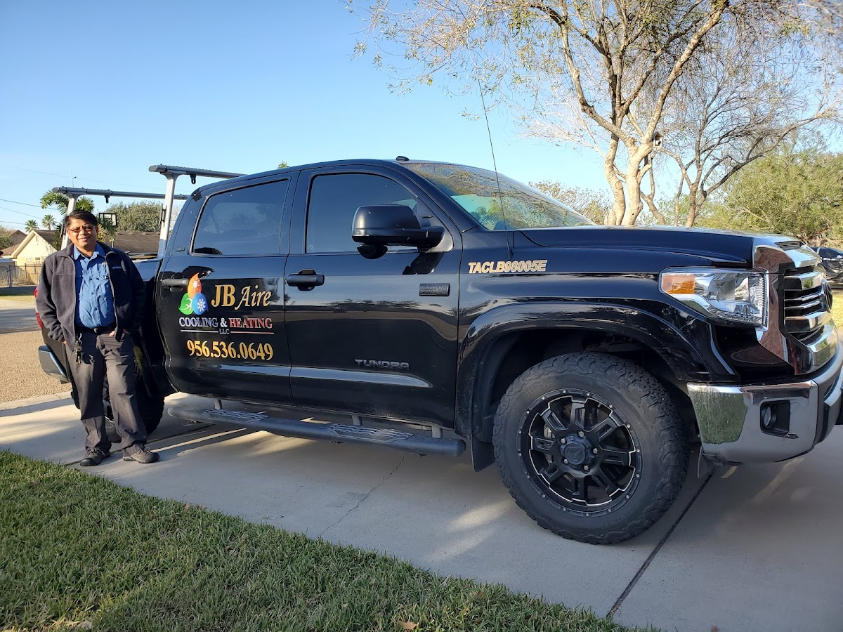 Joseph Barcenilla, owner of JB Aire Cooling and Heating, with his service truck